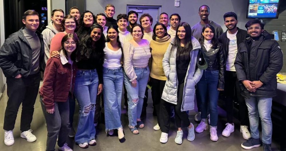 Group of M.S. in Mathematical Finance students at a casual networking event.